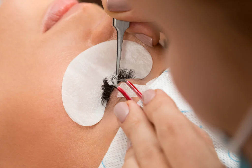 Procedure of eyelashes extension in beauty salon